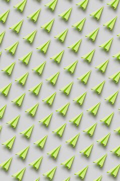 Pattern of green origami paperplanes