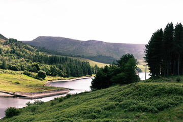 Landscape With A River And Mountains In A Sunny Day