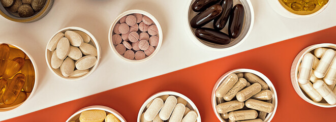 topview of multivitamin biologically active supplements. mental wellbeing and personal health banner