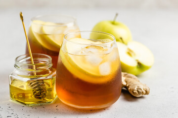 Ginger cinnamon iced tea in glasses. Space ofr text.