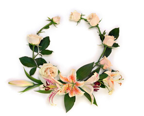 Frame of flowers cream pink roses with lilies on a white background with space for text. Top view,...