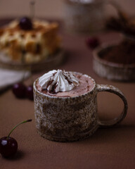 Hot chocolate and brownies on a beige background