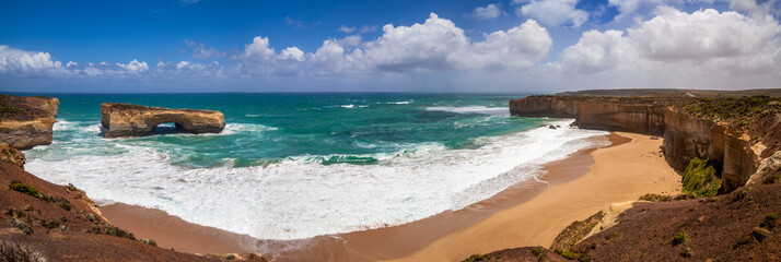 London Bridge at The Twelve Apostles, a famous collection of limestone rock formation off the...