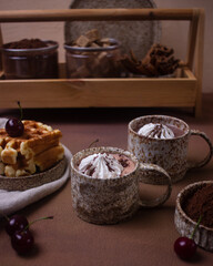 Hot chocolate and brownies on a beige background