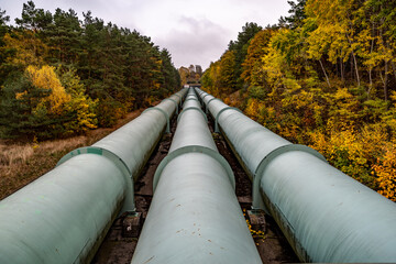 Pipeline of a power plant surrounded by trees
