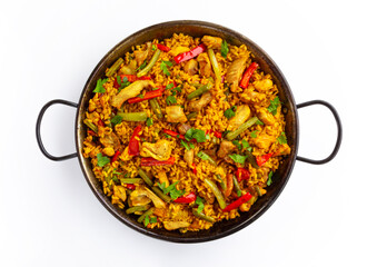 Chicken paella on white background, a traditional Valencian (Spanish) dish made of rice with...