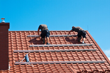 Installing solar panels on house roof