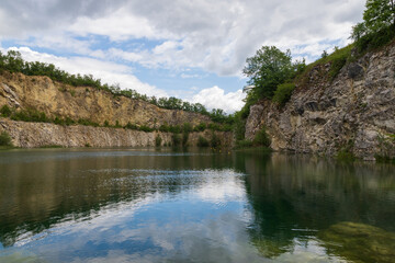 Fototapeta premium Flooded quarry in the Czech Republic near the town of Mikulov in Europe. Beautiful landscape with a water surface.