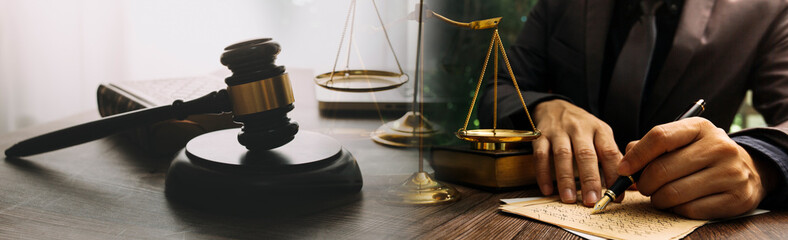 justice and law concept.Male judge in a courtroom on wooden table and Counselor or Male lawyer...