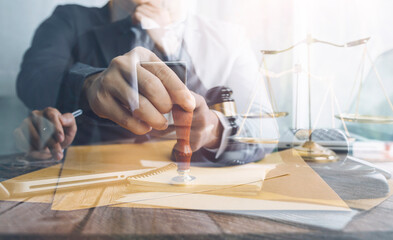 Business and lawyers discussing contract papers with brass scale on desk in office. Law, legal services, advice, justice and law concept picture with film grain effect