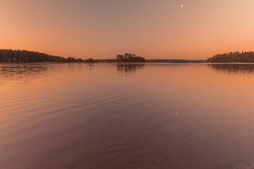 Beautiful sunset over the river. Scandinavian nature. Finland