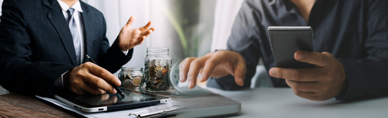 businesswoman hand working with laptop computer, tablet and smart phone in modern office with virtual icon diagram at modernoffice in morning light