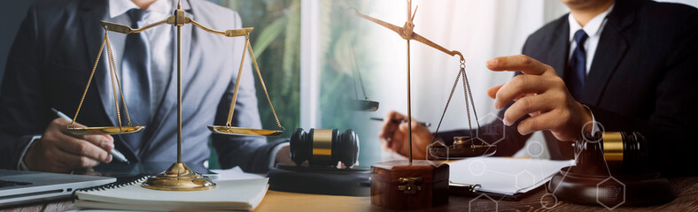 justice and law concept.Male judge in a courtroom on wooden table and Counselor or Male lawyer...