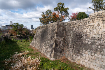 Fototapeta na wymiar Osaka Castle wall of Castle and canal around the Castle