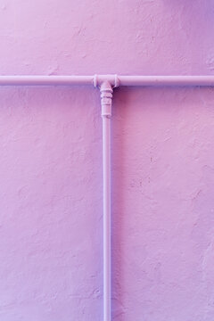 Water pipes on a colored wall