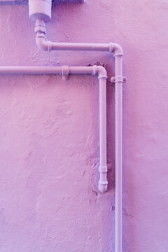 Water pipes on a colored wall