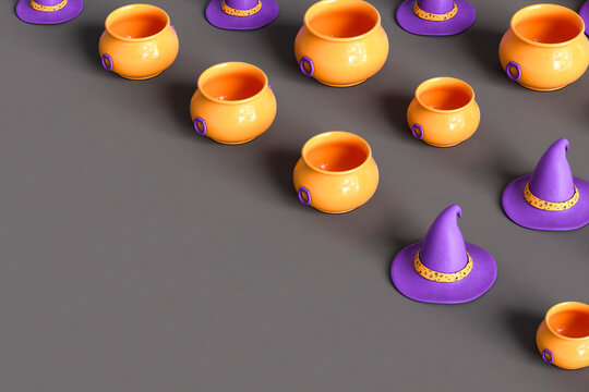 cauldrons and purple witch hat on dark grey background with copyspace