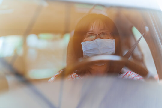 Female driver with a mask