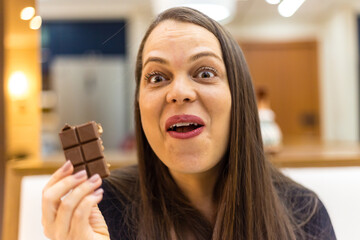 woman eating chocolate