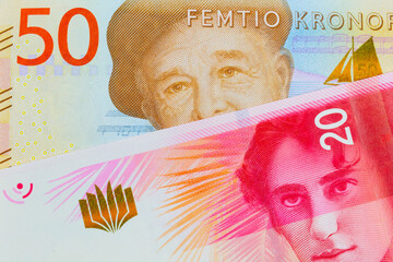A macro image of a gray and orange fifty kronor note from Sweden paired up with a red and white twenty shekel bill form Israel.  Shot close up in macro. - obrazy, fototapety, plakaty