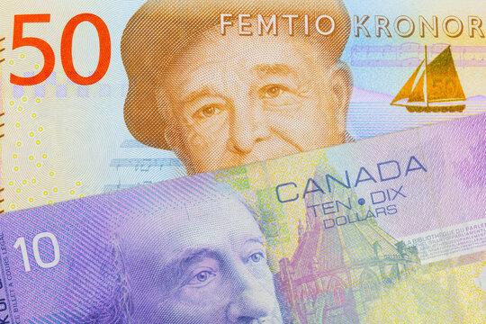 A Macro Image Of A Gray And Orange Fifty Kronor Note From Sweden Paired Up With A Purple Ten Dollar Bill From Canada.  Shot Close Up In Macro.