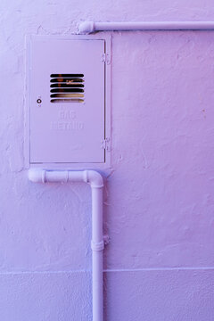 Water pipes on a colored wall