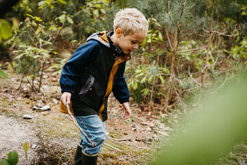 Boy having fun in the forest