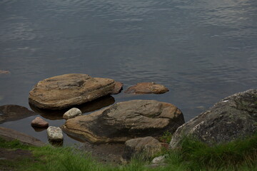 Fototapeta na wymiar Stones on the shore of Lake Semenovskoye, Russia.