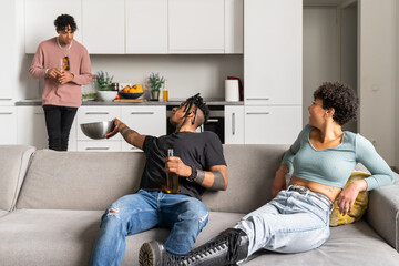 Three Friends Enjoying Snacks At Home