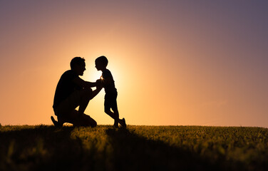 Happy father son moment silhouette. Fatherhood, and childhood concept. 