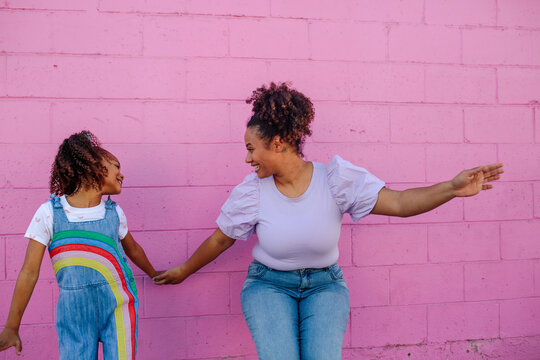 Playful mother and daughter