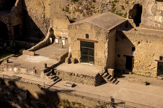 Ruins, streets and buildings of ancient roman town Ercolano - Herculaneum, destroyed by the eruption of the Mount Vesuvius or Vesuvio volcano. Historical park of Ercolano, Italy