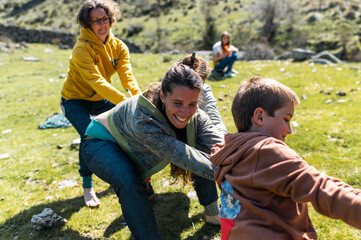 Family having fun playing childhood games outdoor