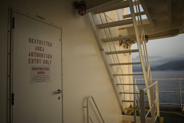 staircase and entry door of a ship's structure