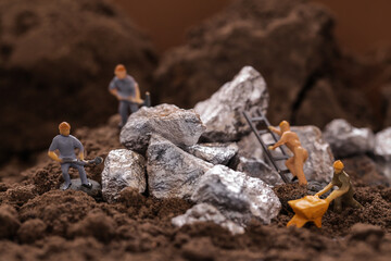 Mining of Cobalt. Renewable energy concept. Miniature worker mining metal zinc and silver. Mining...