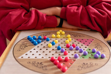 Closeup of a Chinese checkers game in progress 