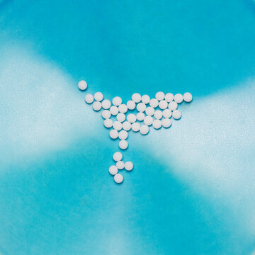 Pills on blue surface