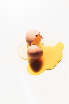 a broken egg in a white background