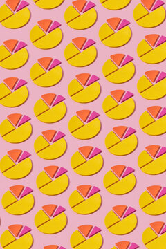 Pattern of colored design diagrams on pink background