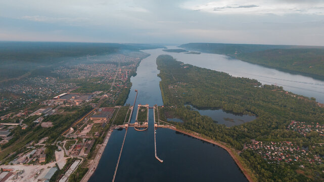 Top-view of a barge ship passing by the gateway