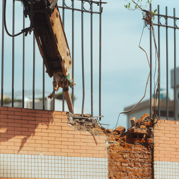 demolishes the wall