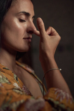 Hispanic woman practicing Nadi Shodhana