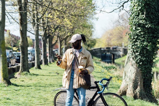 Happy Cyclist Drinking Takeaway Coffee