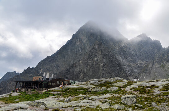 Mountain hut Teryho chata in the Little Cold Valley and peaks of the High Tatras mountains on background. Slovakia