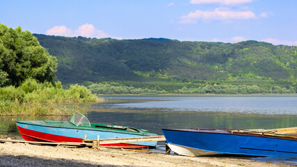 retro boat on the river bank. Old boat