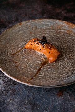 Delicious salmon nigiri on a rustic dish