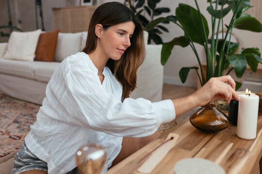 Young woman preparing for yoga session
