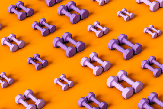 pattern of Purple dumbbells on orange background