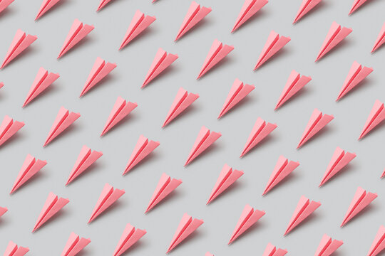 Pattern of pink origami paperplanes