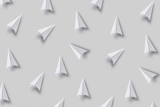 Pattern of white scattered paperplanes